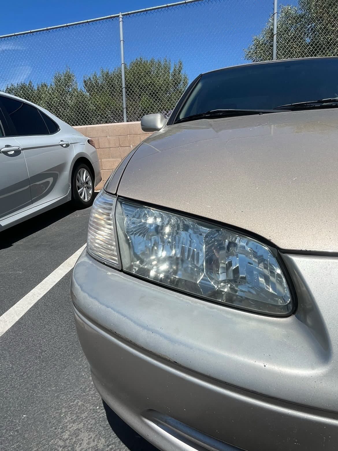 After: clear restored headlight lens on the same car