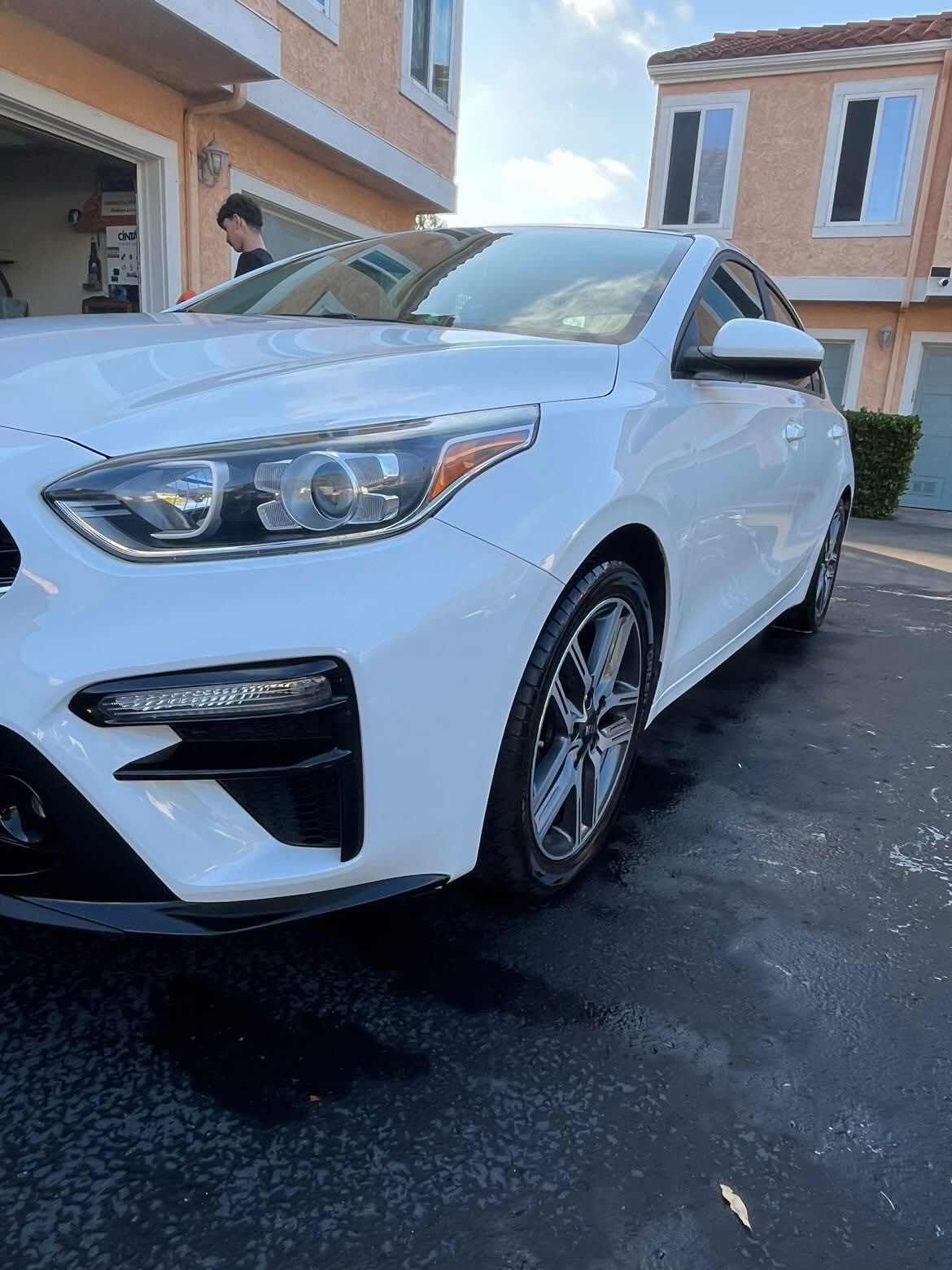 Freshly detailed white sedan exterior
